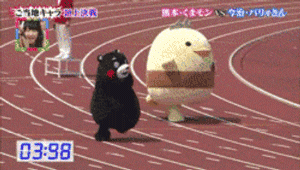 TV gif. Two people in mascot character costumes, a black bear, Kumamon, and a round yellow chick with a tiara, run awkwardly on a race track. We see a commentator window in a corner of the screen, and a timer in another.