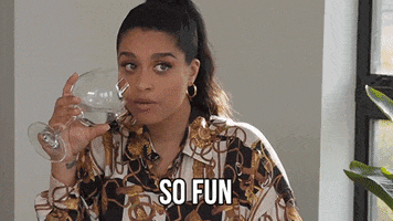 Video gif. Lilly Singh pauses before taking a sip of water, then turns to us with a smile and says: Text, "So fun"