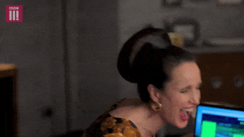 TV gif. Andie MacDowell as Ivy in Cuckoo laughs hysterically as she leans back with her eyes closed and mouth gaping open. 