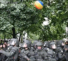 beach ball riot police GIF