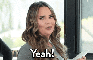 Celebrity gif. YouTuber Rosanna Pansino looks at us with wide eyes. She opens her mouth funny, jutting out her chin and talking out the side of her mouth, saying, “Yeah!”