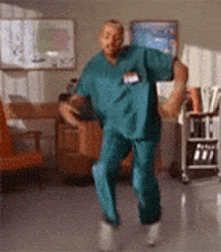 TV gif. Turk played by Donald Faison from Scrubs ecstatically doing a joyous happy dance in celebration.