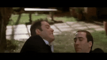 matageli struggle john travolta faceoff nick cage GIF