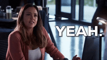 TV gif. Jessica Alba as Nancy in L.A.'s Finest. She sits at a desk and looks up at someone before trying to convincingly say, "Yeah!"