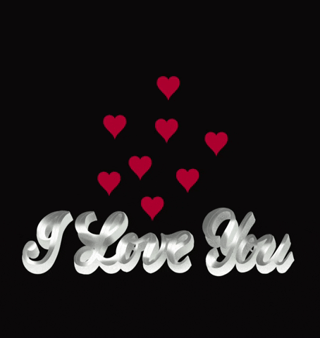Text gif. Against a black background, "I love you" is written in bold white cursive letters. Above the phrase, animated red hearts rise to the top of the screen.