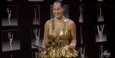 TV gif. Wearing a gold ball gown at the Emmys, Tracee Ellis Ross opens her arms and says, “I bid you… goodnight.”