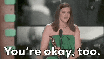 Oscars 2024 gif. Jennifer Lame wins Best Editing for Oppenheimer. Wearing a sleeveless emerald green dress, she bends slightly foward and widens her eyes to acknowledge someone. She says, "You're okay, too."