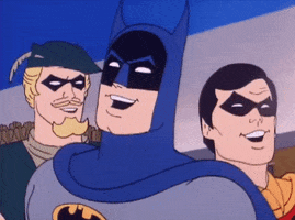 Cartoon gif. Batman, The Green Arrow, and Robbin stand beside each other, facing us, as they laugh together. 