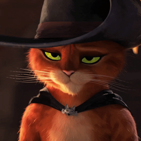 Movie gif. Puss in Boots looks bored as he shrugs his shoulders and says, "Eh."