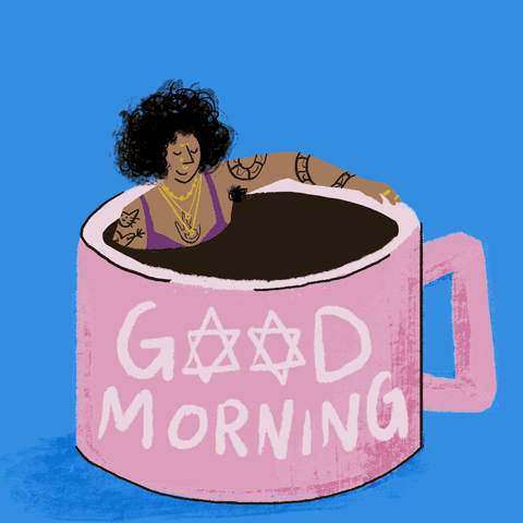 Digital art gif. Woman with tattoos, gold jewelry, and an afro, on a blue background soaking in a steaming mug of coffee as if it were a hot tub, the text across reading "Good morning," with the Star of David in place of the Os.