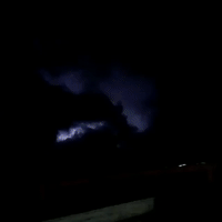 Lightning Flashes Behind Stormy Clouds in San Antonio