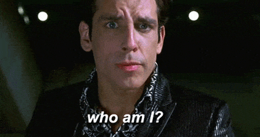 Derek Zoolander asking 'Who am I?' of his reflection in a puddle.