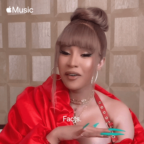Celebrity gif. Cardi B, wearing a light brown wig with bangs and a red satin top, makes the "cut it out" motion with her hand and says, "facts," which appears as text.
