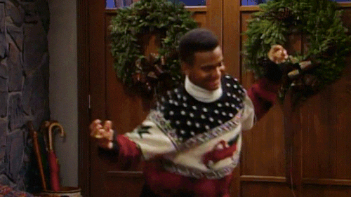 Man in a Christmas sweater doing a little Christmas boogie!