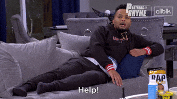TV gif. A man on Partners in Rhyme lounges on a couch and yells, “help!”