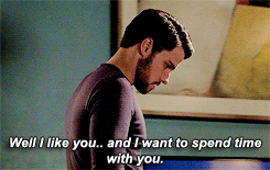 TV gif. Jack Falahee as Connor Walsh in How to Get Away with Murder shrugs his shoulders as he paces the room and says matter-of-factly, "Well I like you.. and I want to spend time with you," which appears as text.