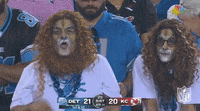 Lions fan wearing cheese grater hats (GIF)