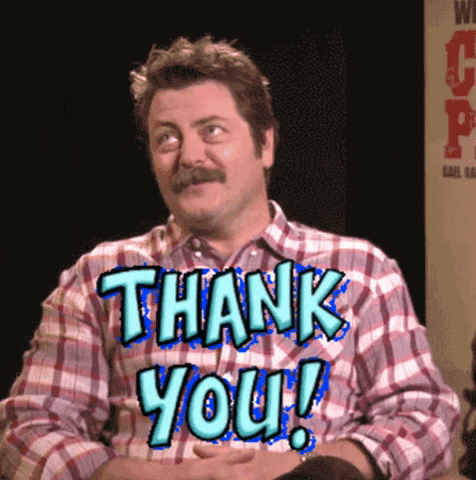 Celebrity. Nick Offerman giggles shyly, shrugging his shoulders up towards his ears. Text, “Thank you!”