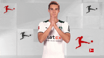Sports gif. German soccer player Florian Neuhaus holds his hands together and bows in a gesture of thanks.