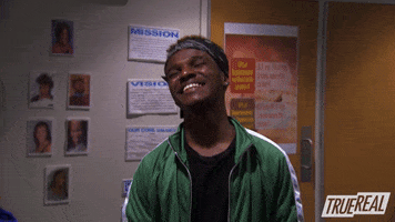 Reality TV gif. A man on the Rap Game excitedly daps up another person while laughing