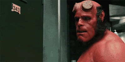 Movie gif. David Harbour as Hellboy points a red finger towards us as he speaks over his shoulder. Text, "Stop it. Right now."