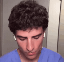 Guyflickingairpods GIF