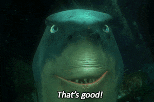 Movie gif. Bruce the shark from Finding Nemo speaks with a growing, nefarious smile as his pupils dilate and he bellows, "That's good!"