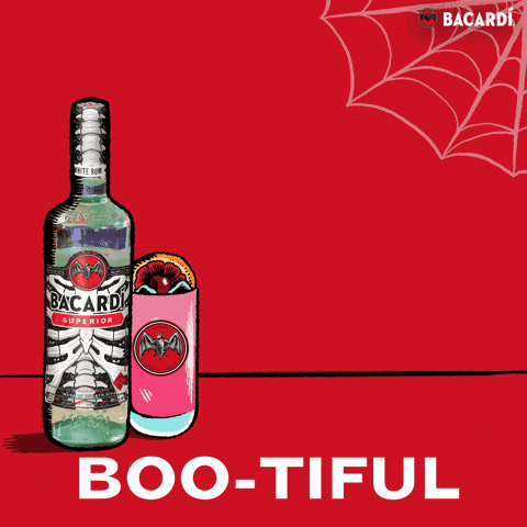 Sponsored gif. A Halloween-themed bottle of Bacardi and a cocktail in a tumbler with the Bacardi logo against a red background. A ghost appears behind the drinks and a pink heart appears over the ghost's head. Text reads "BOO-TIFUL."