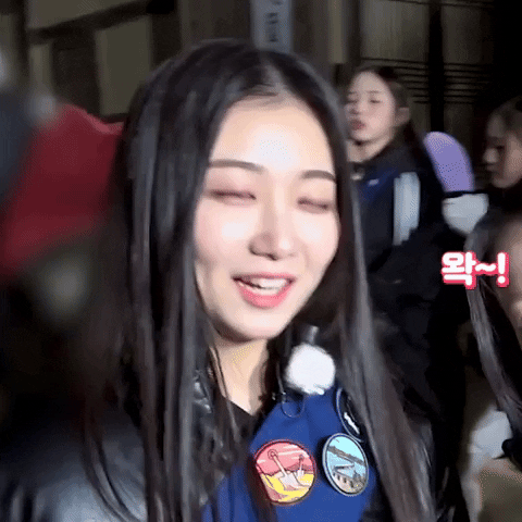 Celebrity gif. Yamada Kaede from K-pop group, tripleS, looks delightfully surprised as she perks her shoulders, widens her eyes and opens her mouth. 