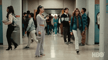 TV gif. Alexa Demie as Maddy on Euphoria in the middle of busy high school hallway, looking surprised and pissed off as she pivots from one foot to the other.