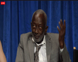 Celebrity gif. Garrett Morris rolling his eyes up and tossing his hand in the air while smiling and shaking his head.