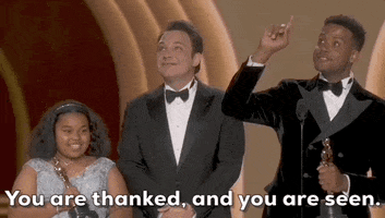 Oscars 2024 gif. The Last Repair Shop wins Best Documentary Short. Ben Proudfoot and Kris Bowers point up into the crowd and clap. Bowers says, "You are thanked, and you are seen." 