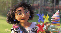 Disney gif. Mirabel from "Encanto" holds an armful of party decorations and supplies and appears perplexed, half-smiling as she says, "Uhh... thanks," which appears as text.