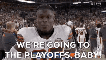 Sports gif. A Cleveland Browns football player runs towards us and grabs the lens of the camera as he excitedly says, "We're going to the playoffs baby!'