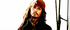Movie gif. Johnny Depp as Captain Jack Sparrow in Pirates of the Caribbean gives a straight-faced salute of acknowledgment.