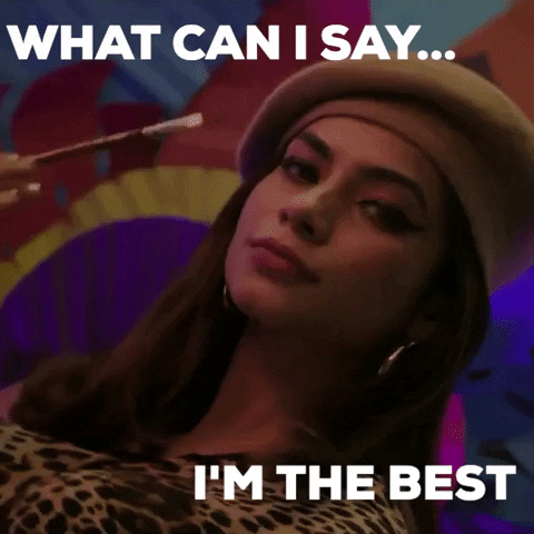 Celebrity gif. Influencer Nagma Mirajkar, wearing a beret and holding a paintbrush, smiles. Text, “What can I say…I'm the best.”