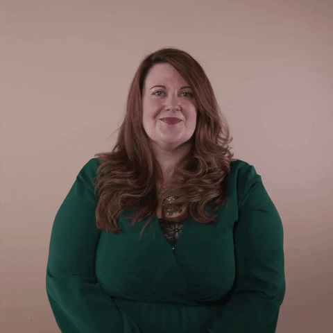 Reaction gif. A non-apparently Disabled white woman with with anxiety and depression and long red hair punctuates with a knowing wink.