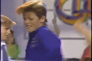 Meme gif. Blonde boy Duane from Barbie Dance Club movie doing a Soul Train-like dance down a line of other kids. 