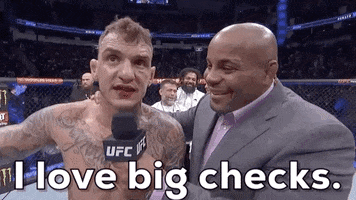 Sports gif. Speaking into Daniel Cormier's mic, Renato Moicano glances upward while saying, "I love big checks," which appears as text.