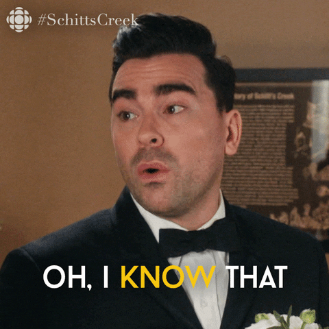 Schitt's Creek gif. Dan Levy as David in black tie says "Oh I know that" while eyeing his conversation partner up and down. 