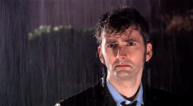 disappointed standing in the rain GIF