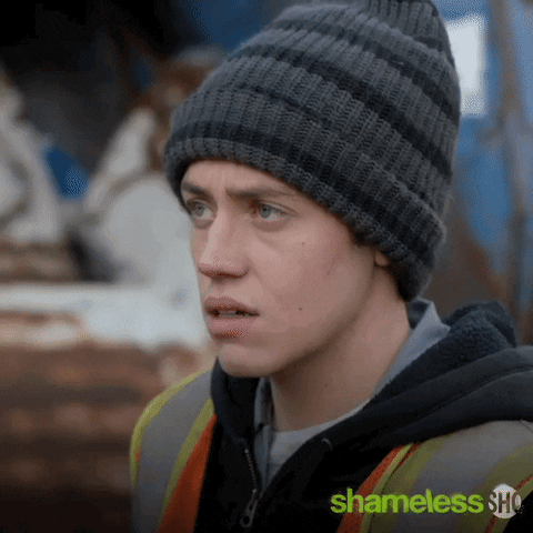 TV gif. Ethan Cutkosky as Carl Gallagher on Shameless looking offended, stepping backward and closing his eyes.