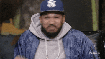 TV gif. Wearing a New York Yankees hat and a blue jacket over a gray hoodie, The Kid Mero from Desus & Mero makes excited running motions.