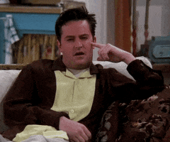 Friends gif. Matthew Perry as Chandler sits on a couch with a bored expression, holding his head up with his finger. He stares off, thinking, and says, “I just realized I could sleep with my eyes open."