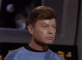 TV gif. William Shatner as Kirk and Deforest Kelley as Leonard on Star Trek firmly nod to each other in complete agreement.