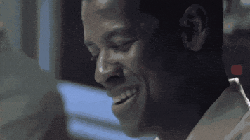 Movie gif. Denzel Washington as Lieutenant Commander Ron Hunter in "Crimson Tide" smiles and shakes his head slightly before saying sternly, "In the nuclear world, the true enemy is war itself."