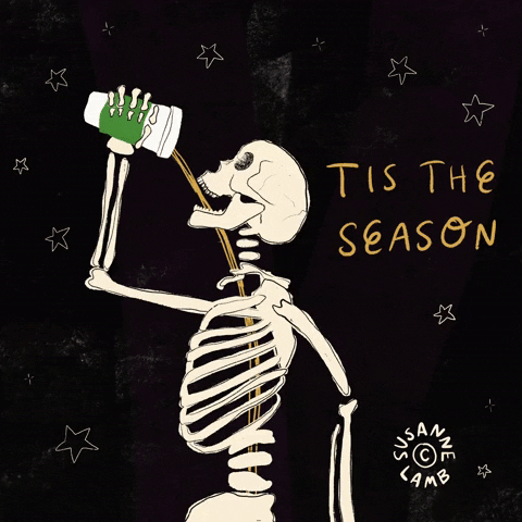 Cartoon gif. A skeleton pours a pumpkin spice latte into its mouth against a black background filled with dancing star motifs. The coffee spills through its open ribcage. Text, "Tis the season"