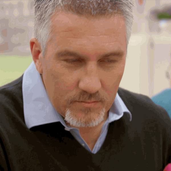 Reality TV gif. Paul Hollywood on The Great British Bake Off looks over at someone and then looks around, thinking.