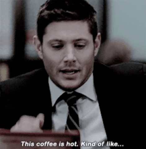 TV gif. Text, "This coffee is hot. Kind of like," Jensen Ackles as Dean in Supernatural clicks his teeth and points toward you.