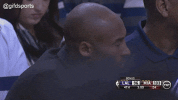 Sports gif. Kobe Bryant is watching a Lakers and Heat game and is very disappointed in what he's seeing. He shakes his head, rolls his eyes, and puts his head in his hand while rubbing lightly.